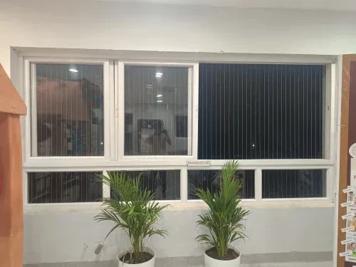 Invisible grills fitted across a sliding window in a Hyderabad home